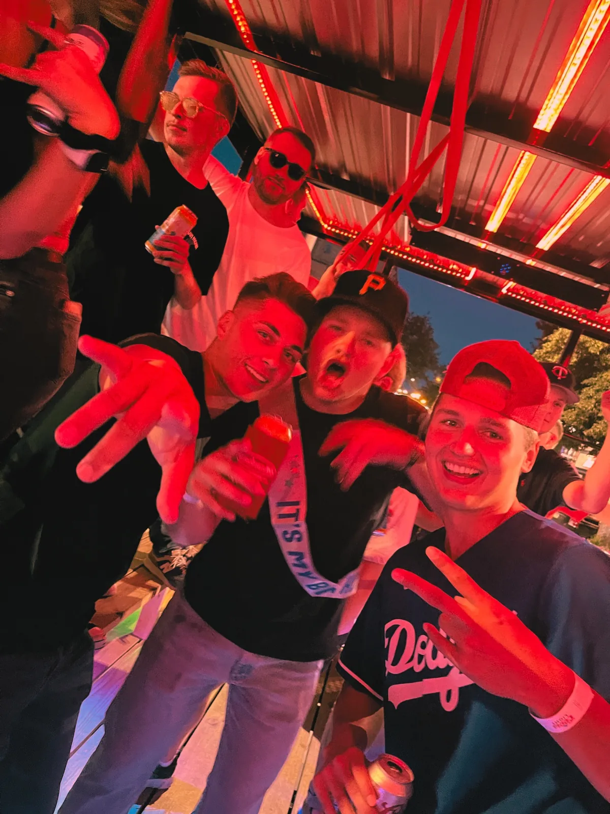 Group of guys celebrating a bachelor party and birthday party on the SuFu Tractor party wagon in downtown Sioux Falls SD