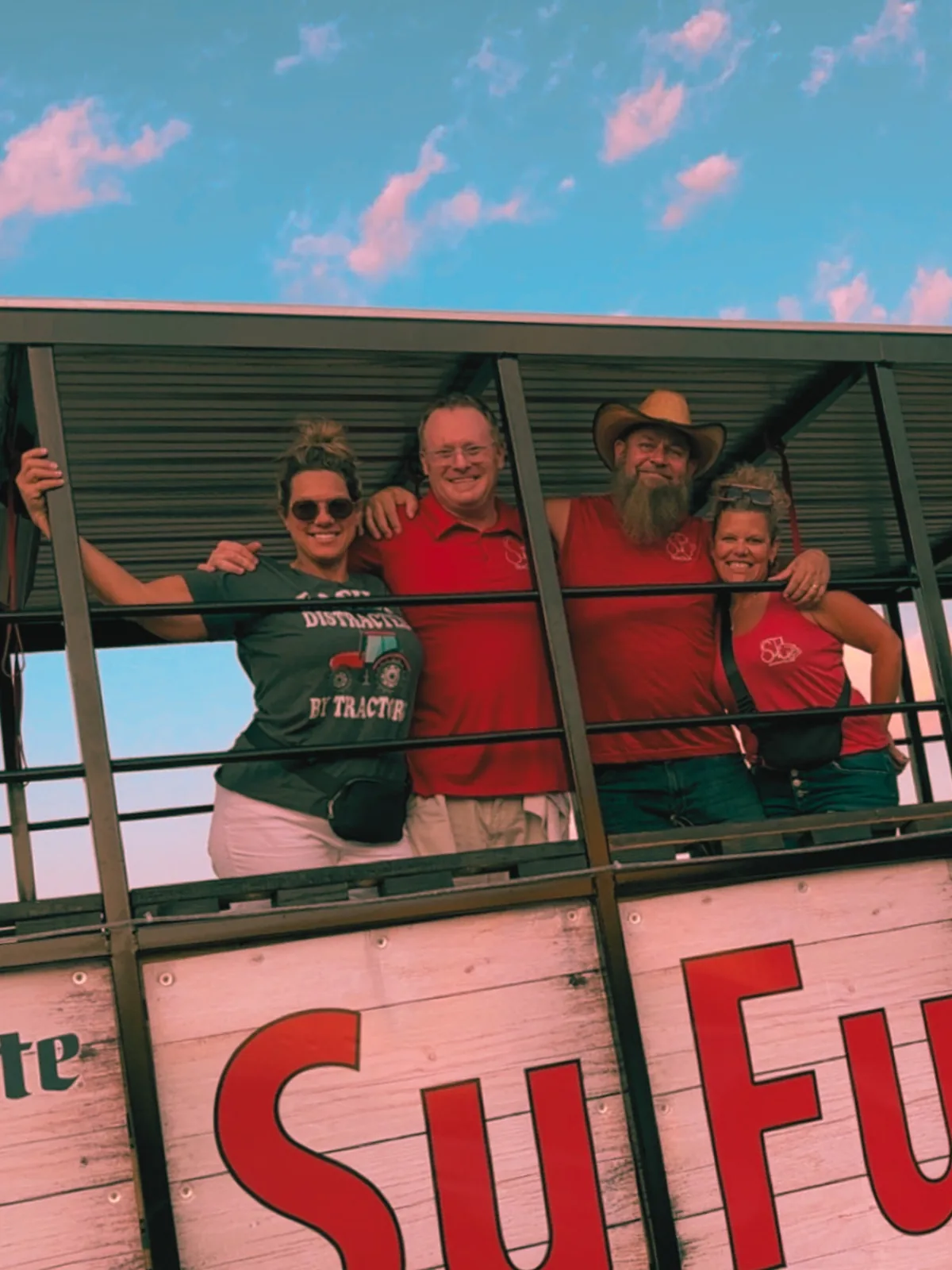 SuFu Tractor team and staff posing on the party wagon in Sioux Falls SD